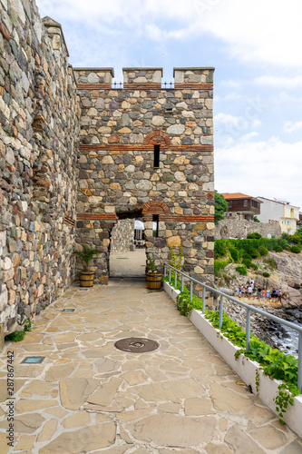 Promenade along the old fortress wall of the ancient seaside town of Sozopol. Bulgaria.