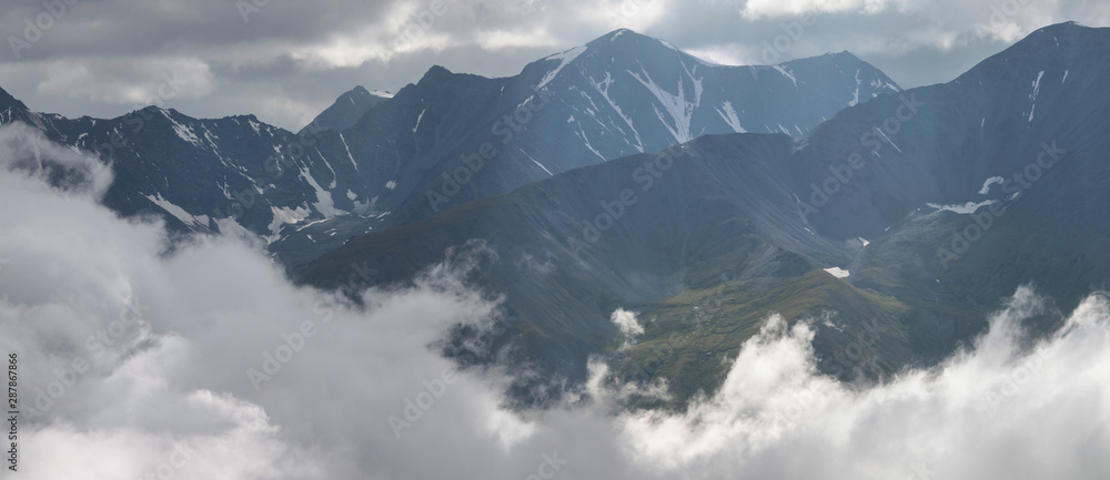 Mountains in the clouds, panoramic view