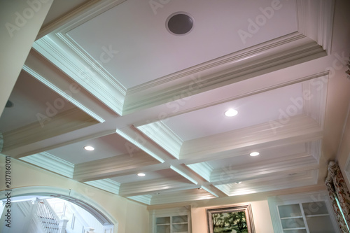 Coffered ceiling and a lot of natural light from the large windows. photo