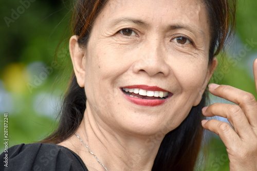 An Asian Female Senior Smiling