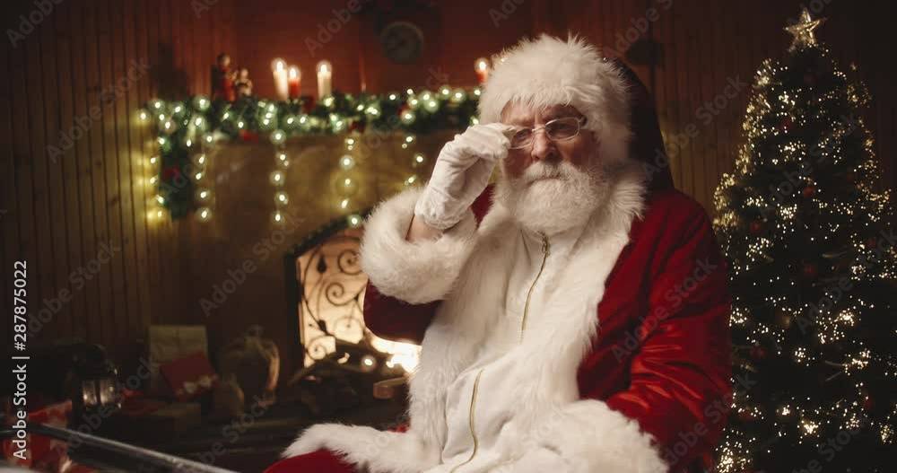 Senior bearded man in santa claus clothing is working on letter at his typewriter then looking at camera - christmas spirit, holidays and celebrations concept 4k footage Senior bearded man in santa claus clothing is working on letter at his typewriter then looking at camera - christmas spirit, holidays and celebrations concept 4k footage