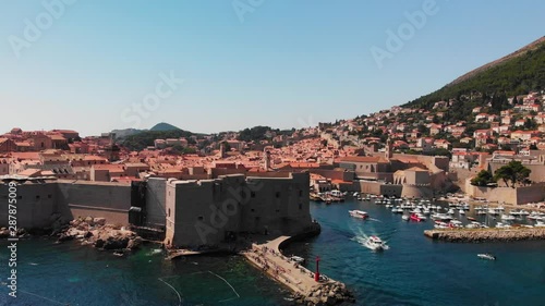 The fortress and harbour of Dubrovnik and the red-tiled buildings - aerial parallax photo