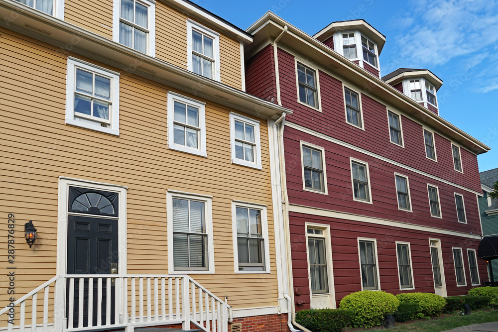 Row of colorful large old wood frame houses