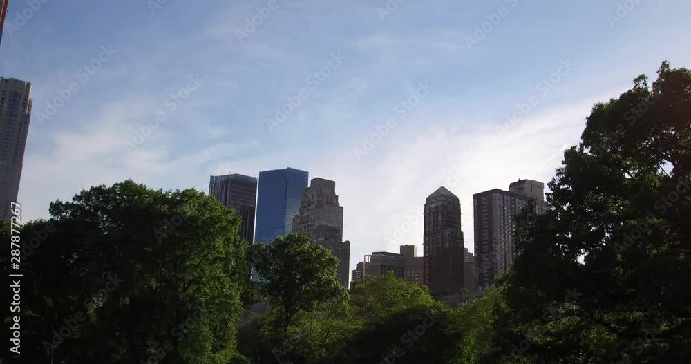 View of the skyscrapers from the Central Park in New York in the afternoon. View of the skyscrapers from the Central Park in New York in the afternoon.