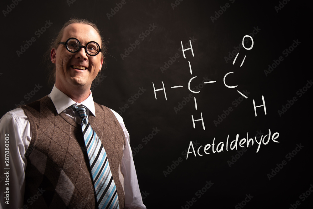 Professor presenting handdrawn chemical formula of acetaldehyde Professor presenting handdrawn chemical formula of acetaldehyde