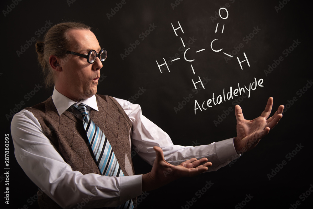 Professor presenting handdrawn chemical formula of acetaldehyde Professor presenting handdrawn chemical formula of acetaldehyde