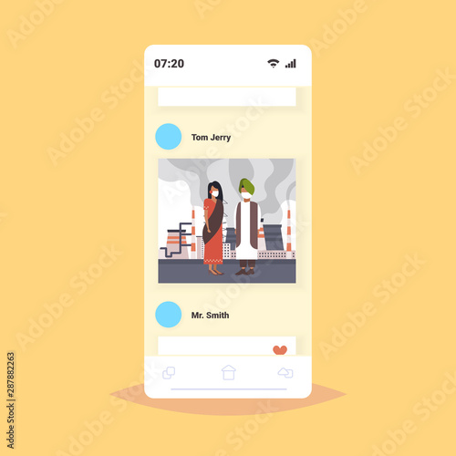 arab couple in face masks plant pipe toxic air pollution industry smog polluted environment concept arabic man woman walking outdoor industrial landscape smartphone screen full length