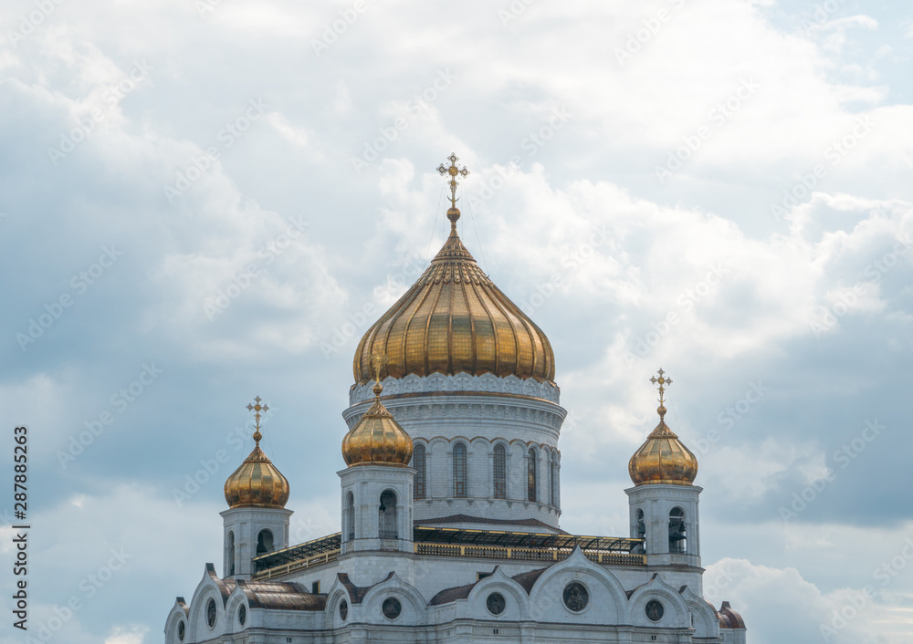 golden domes of the church with crosses against the sky