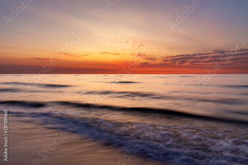 Colourful sky over the north sea after sunset at the beach on Juist  East Frisian Islands  Germany.