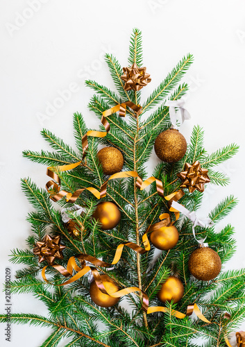 Christmas tree with balls made of branches on a white background.