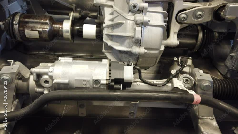 Electric Vehicle Enginge/Motor and Cable up Pan 4K Electric Vehicle Enginge/Motor and Cable up Pan 4K