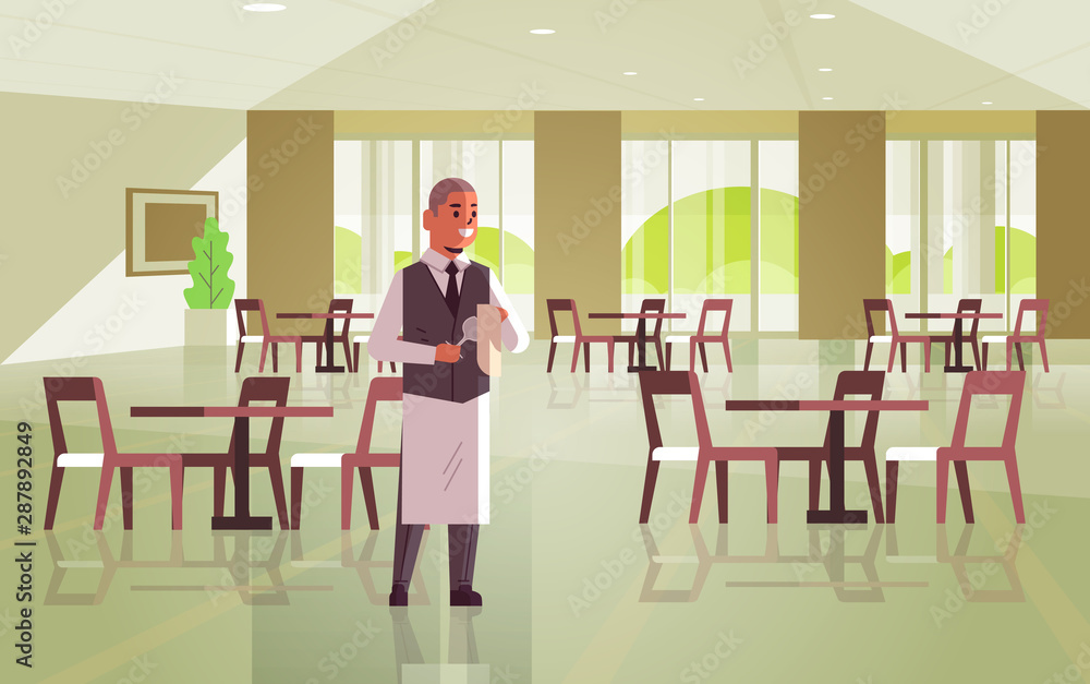 Fototapeta premium professional waiter polishing wine glass with towel man restaurant worker in uniform modern cafe interior flat full length horizontal