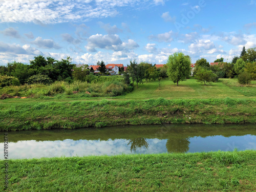 Promenade along the bank of the river Orljava or Setnica uz obalu rijeke Orljave - Pozega, Croatia photo