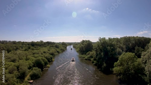 Aerial Drone Footage of a boat along the River Waveney, Norfolk. photo