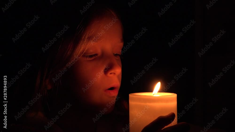 Happy Child with Candles, Prayer Girl in Night, Kid Portrait, Face in Dark 4K Happy Child with Candles, Prayer Girl in Night, Kid Portrait, Face in Dark 4K