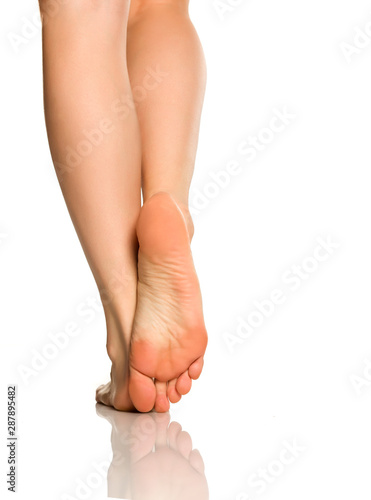 Beautifully groomed female feet on a white background © vladimirfloyd