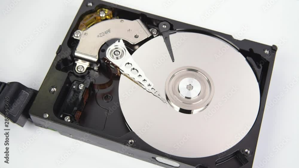 Close-up of the inside of a computer hard disk doing reading and writing. Close-up of the inside of a computer hard disk doing reading and writing.