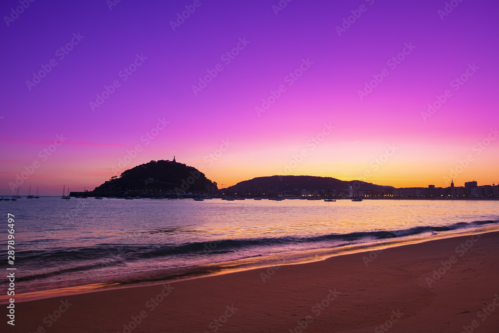 Sunrise at La Concha beach with Mount Urgull and the city of Donostia in the background, Euskadi