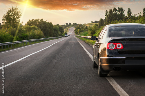 black car on asphalt road