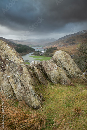 Winter landscape image of the view from Crimpiau and The Pinnacles towards Llynnau Mymbyr and snowcapped Snowdon in the distance photo