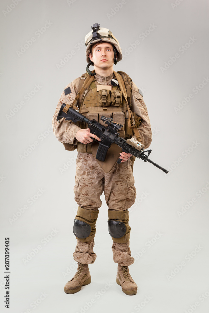 United states Marine Corps special operations command raider with weapon. Studio shot United states Marine Corps special operations command raider with weapon. Studio shot