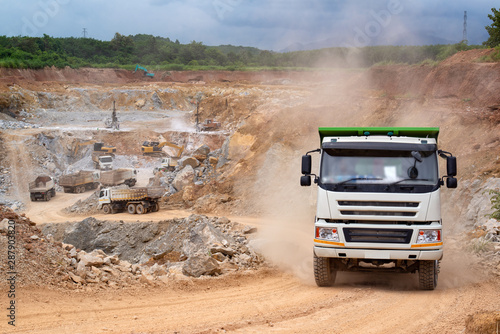 Diesel trucks used in modern mines and quarries for hauling industrial quantities of ore or coal.