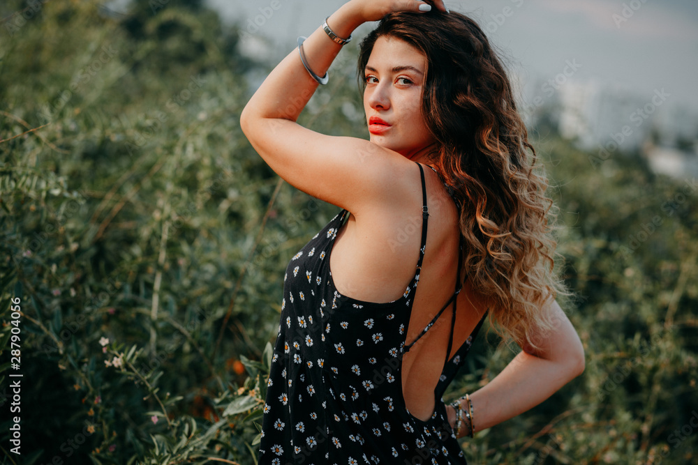 Naklejka premium Young girl in summer time full of joy and harmony