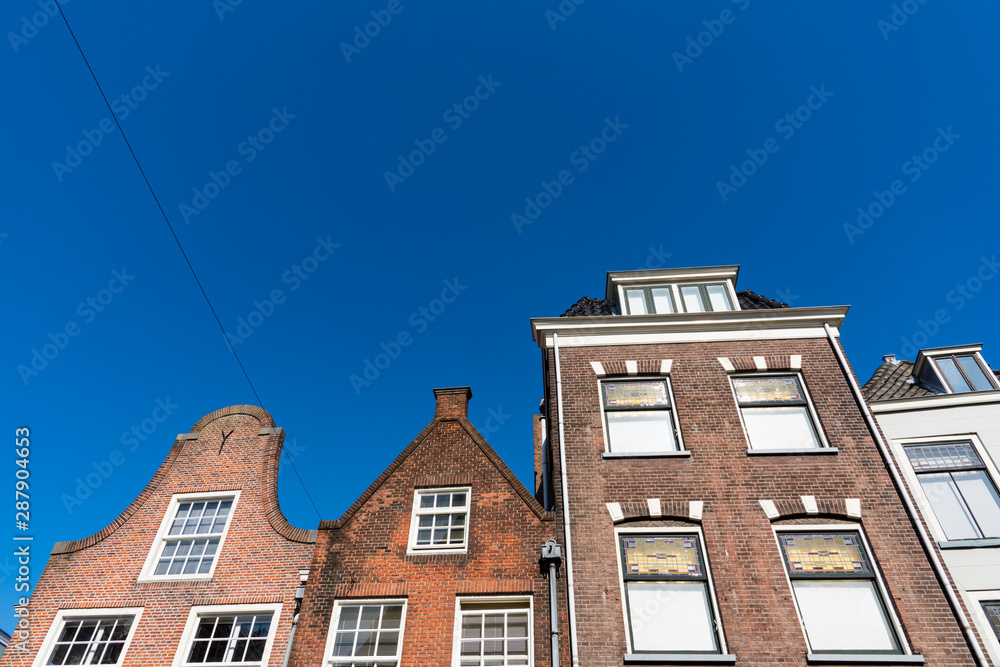 Apartments and houses in street called Oude Langendyk. In Delft, The Netherlands
