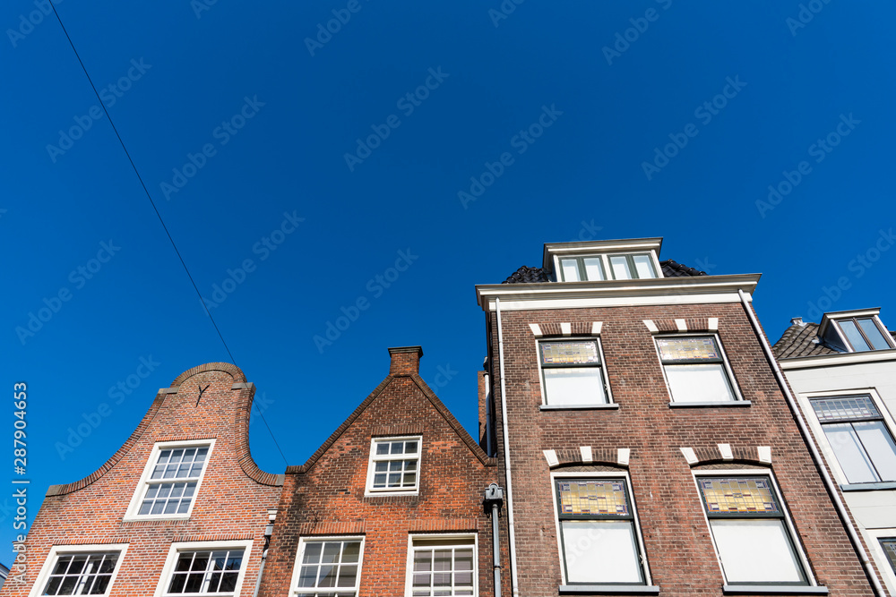 Apartments and houses in street called Oude Langendyk. In Delft, The Netherlands Apartments and houses in street called Oude Langendyk. In Delft, The Netherlands