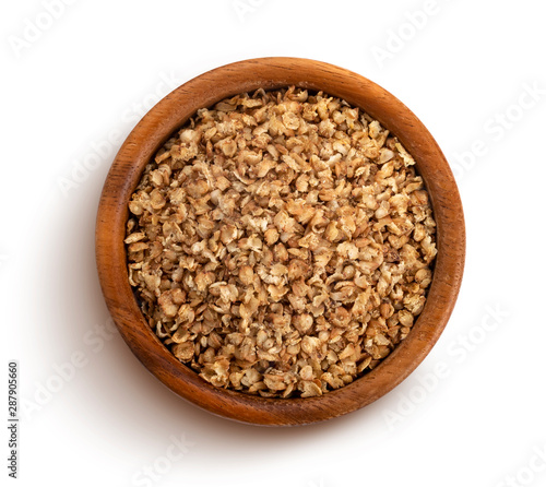 Buckwheat flakes isolated on white background with clipping path