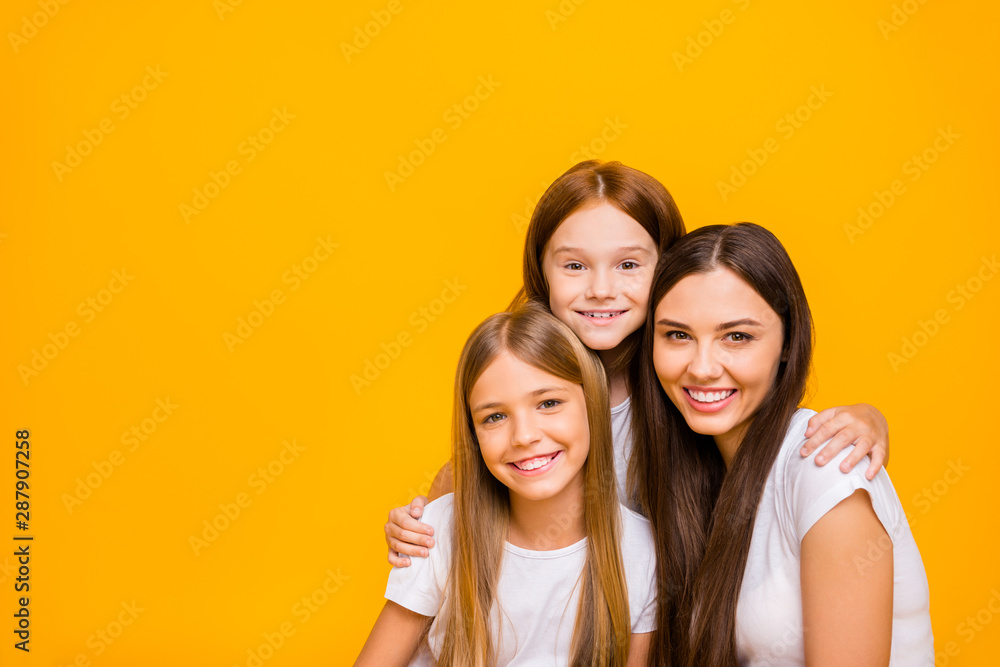 Photo of three amazing ladies of different age hugging wear casual clothes isolated yellow background Photo of three amazing ladies of different age hugging wear casual clothes isolated yellow background