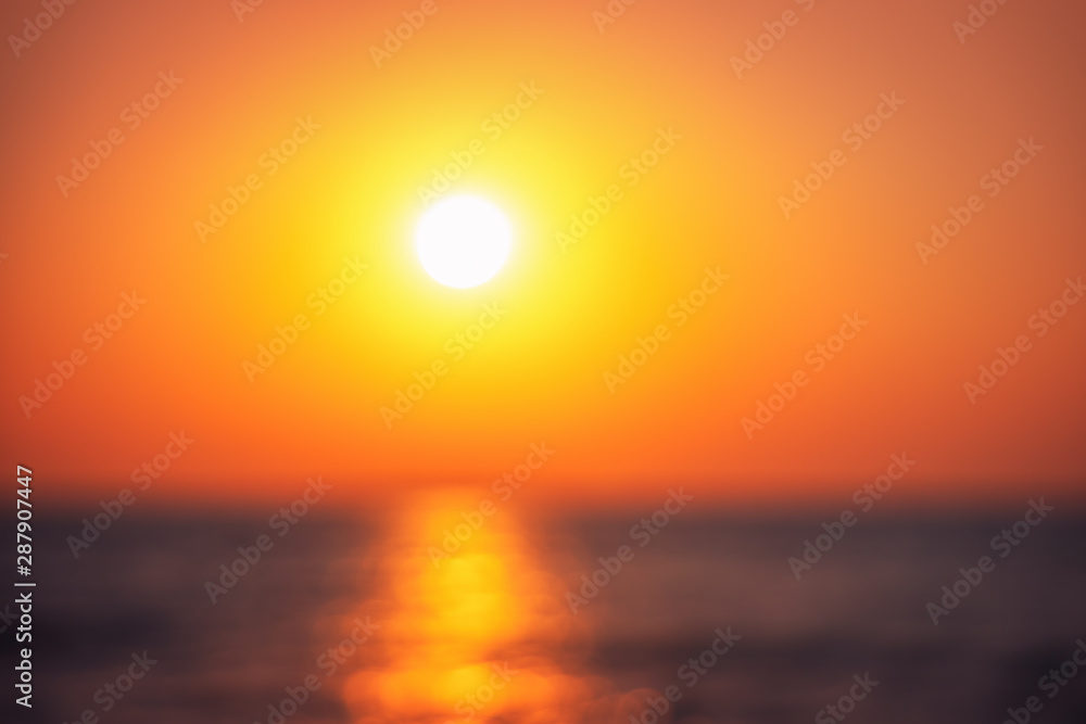 Defocused background ot beautiful sunrise over the tropical seadefo Defocused background ot beautiful sunrise over the tropical seadefo