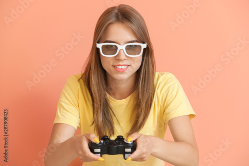 Teenage girl playing video ...