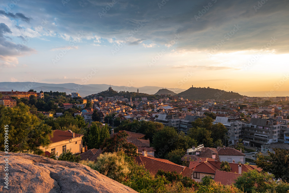 Summer sunset cityscape from Nebet tepe Hill in Plovdiv city, Bulgaria. Panoramic view. Ancient Plovdiv is UNESCO's World Heritage.