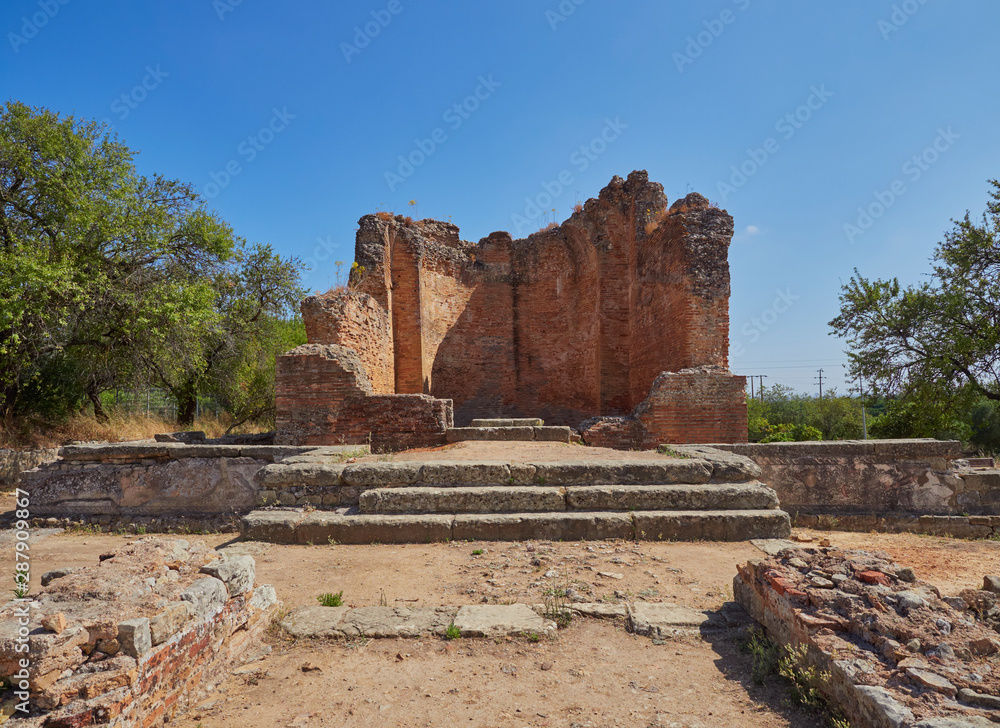 Fototapeta premium Looking up the steps towards the Water Temple at the Roman ruins of Milreu in the town of Estoi on the Algarve of Portugal.