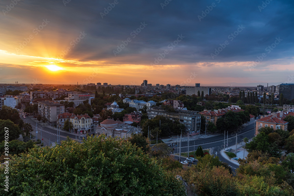 Summer sunset cityscape from Nebet tepe Hill in Plovdiv city, Bulgaria. Panoramic view. Ancient Plovdiv is UNESCO's World Heritage.
