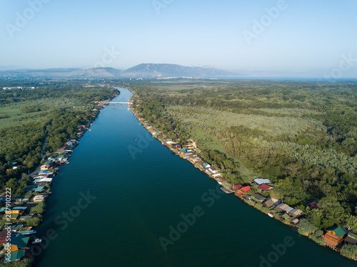 Floating restaurants and guesthouses located on the river bank photo