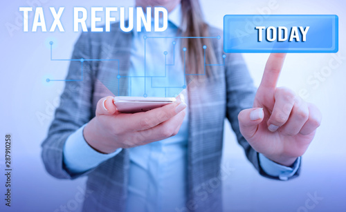 Word writing text Tax Refund. Business photo showcasing refund on tax when the tax liability is less than the tax paid Lady front presenting hand blue glow futuristic modern technology tech look