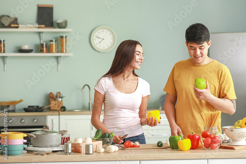 Happy couple cooking togeth...