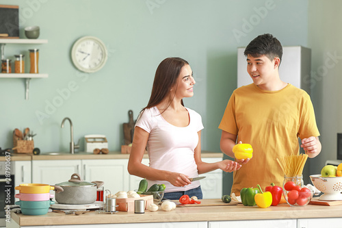 Happy couple cooking togeth...