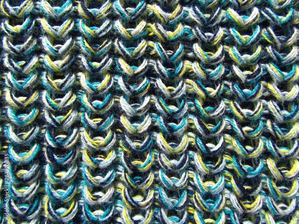 Melange knitted fabric. Macro. Colorful knitted texture background. Stock  Photo