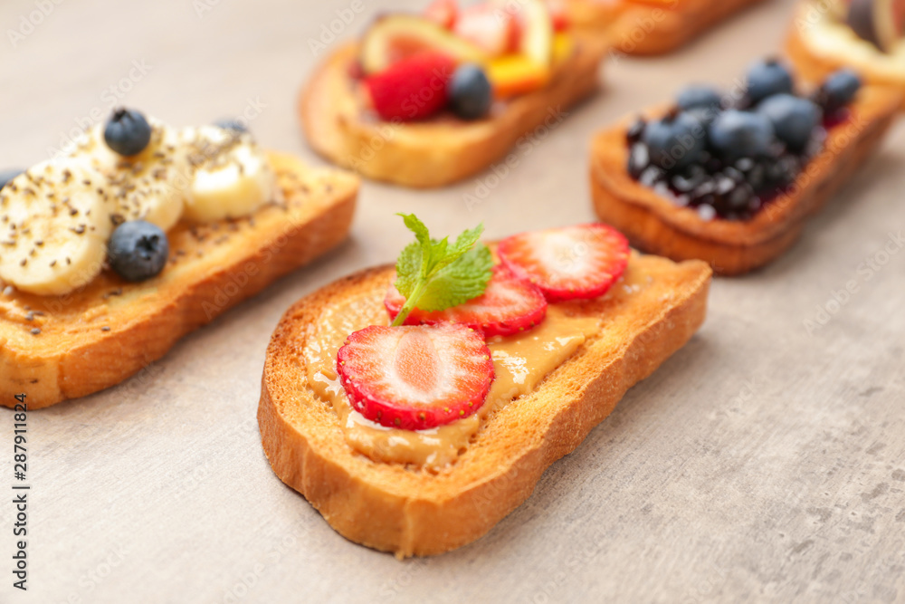 Different tasty sandwiches on grey background Different tasty sandwiches on grey background