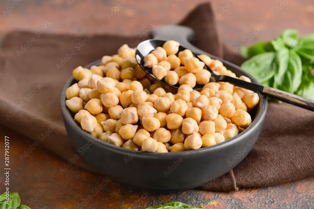 Frying pan with raw chickpea on table Frying pan with raw chickpea on table
