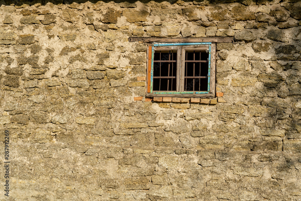 Window in the old stone wall