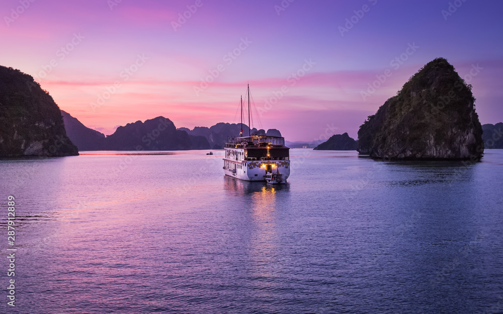 Sunset with tourist boat, Ha Long Bay, Vietnam