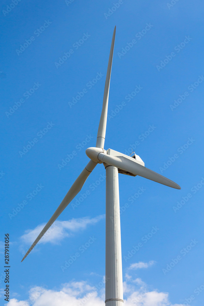 single realistic windmill on blue sky background, ecological concept single realistic windmill on blue sky background, ecological concept