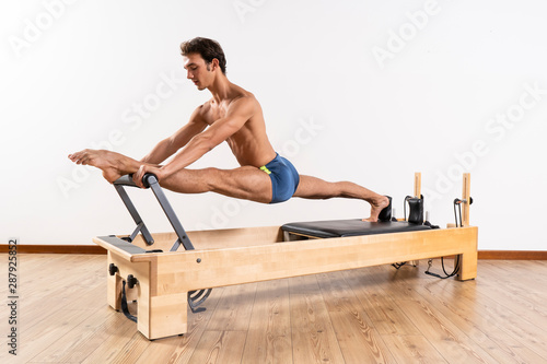 Pilates exercise on the reformer machine