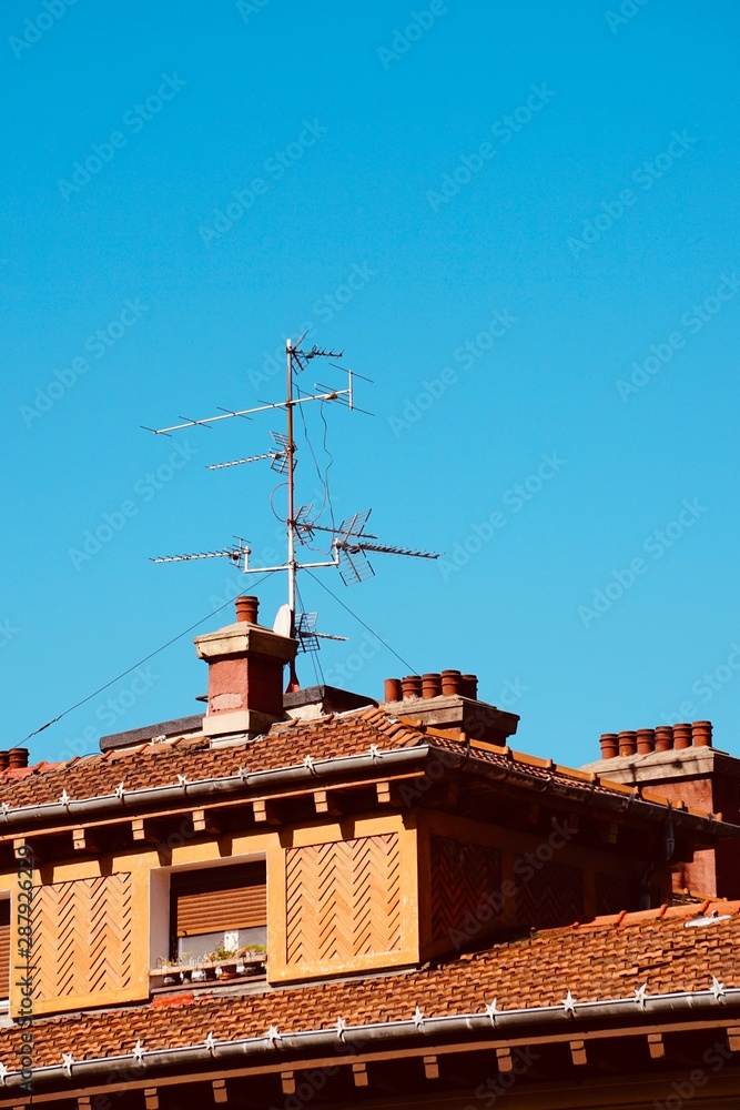 television antenna on the roof of the building