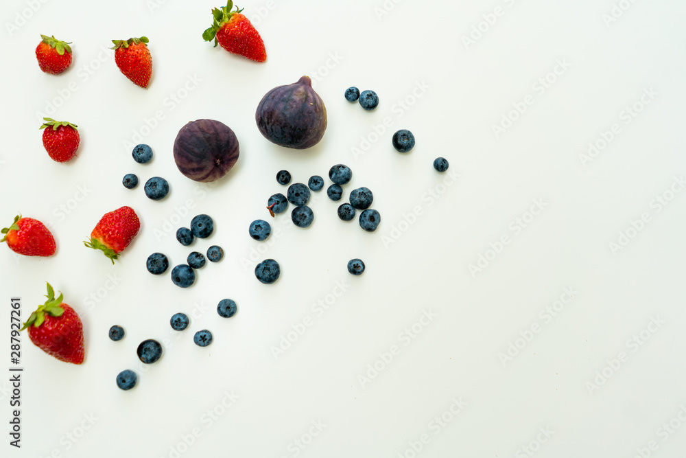 Summer flat lat background with copy space on right and different berries. Summer flat lat background with copy space on right and different berries.