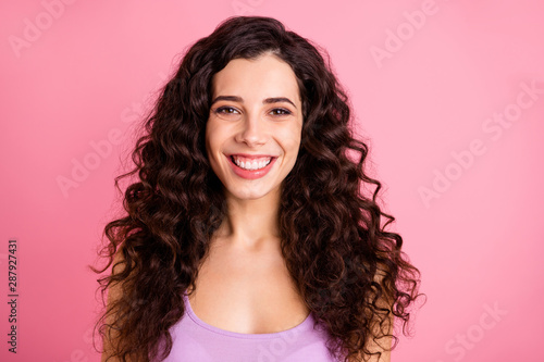 Photo of charming cute nice girlfriend toothily smiling staring at camera while isolated with pink background